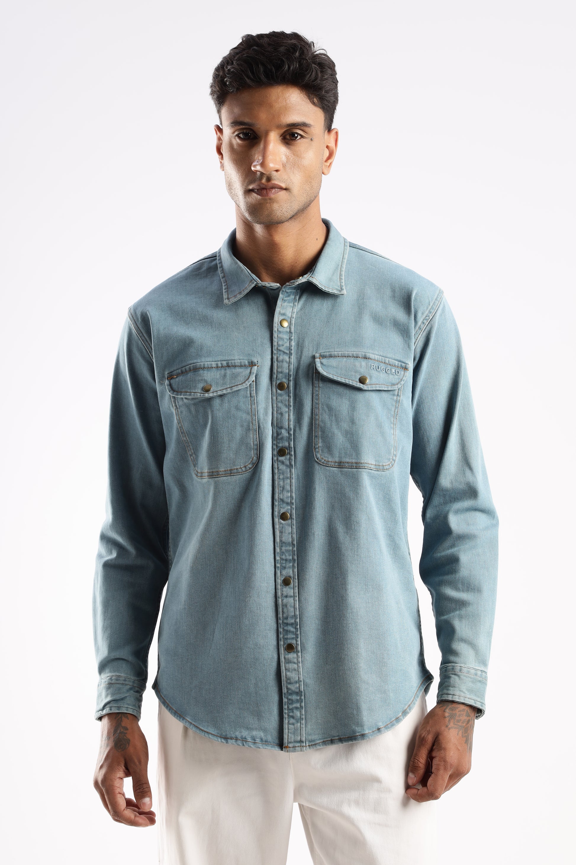 Men’s blue denim shirt with utility chest pockets and snap button closures in Skybound Indigo