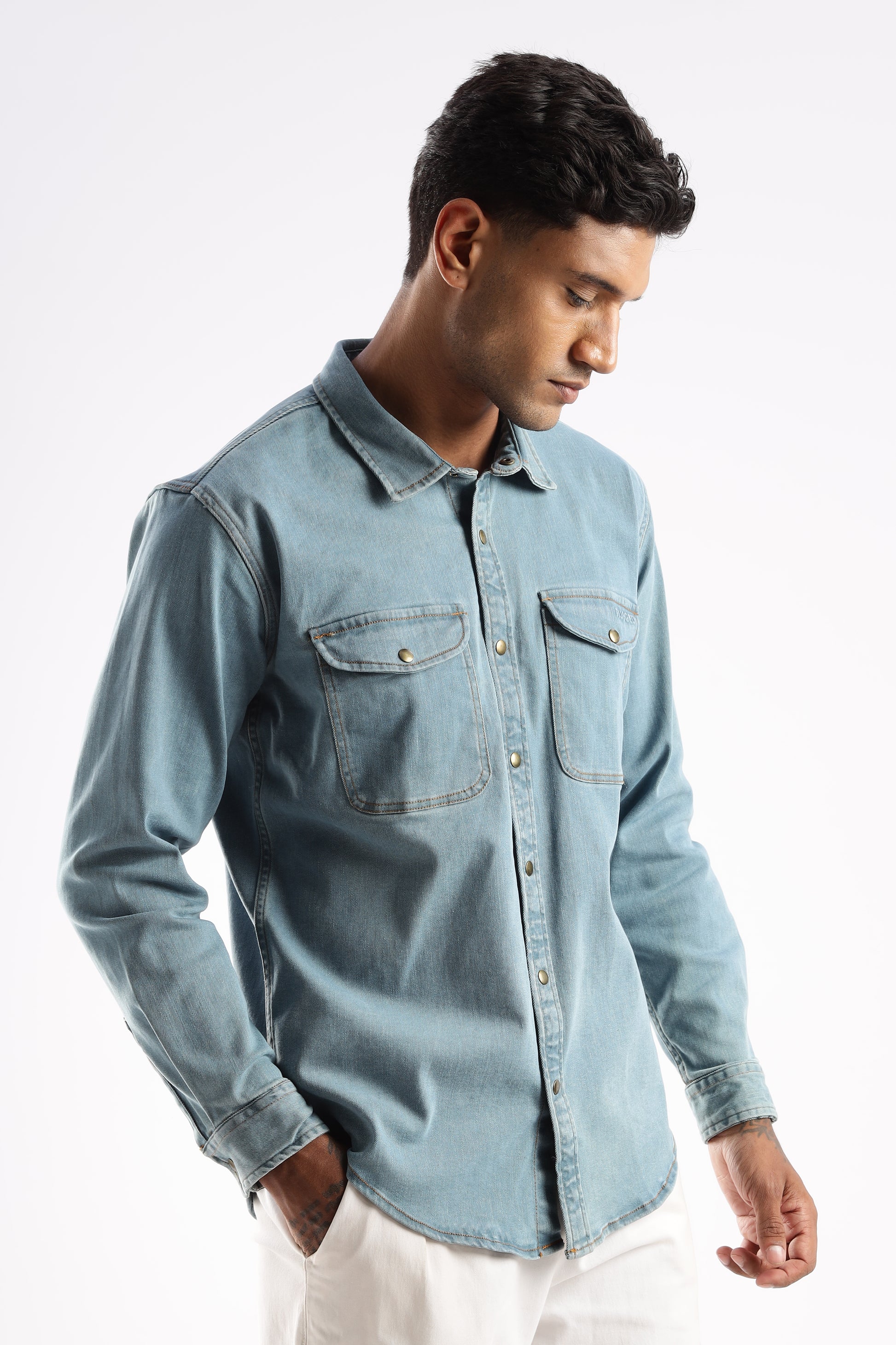 Model wearing Premium Denim Shirt in Skybound Indigo with snap buttons and utility pockets