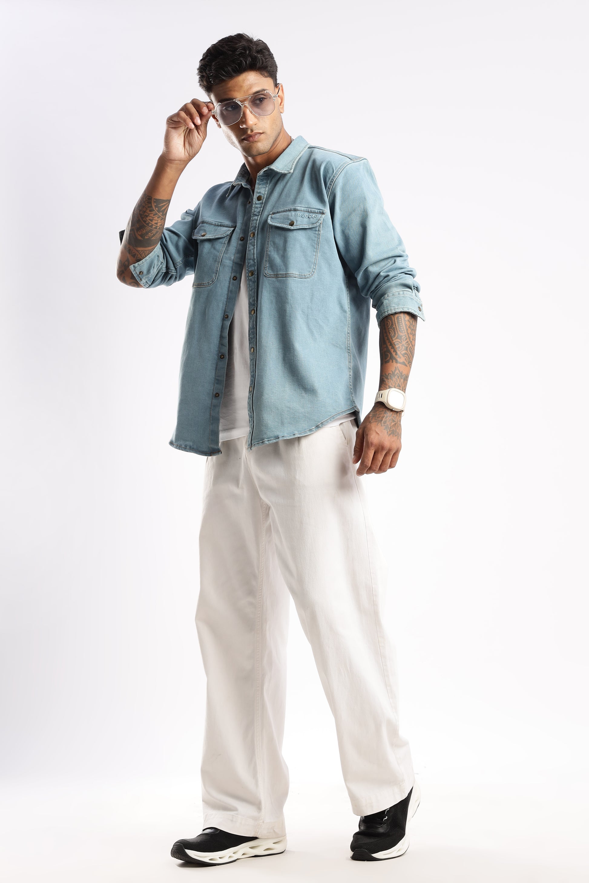 Flat lay of Premium Denim Shirt in Skybound Indigo showcasing collar, buttons, and fabric weave