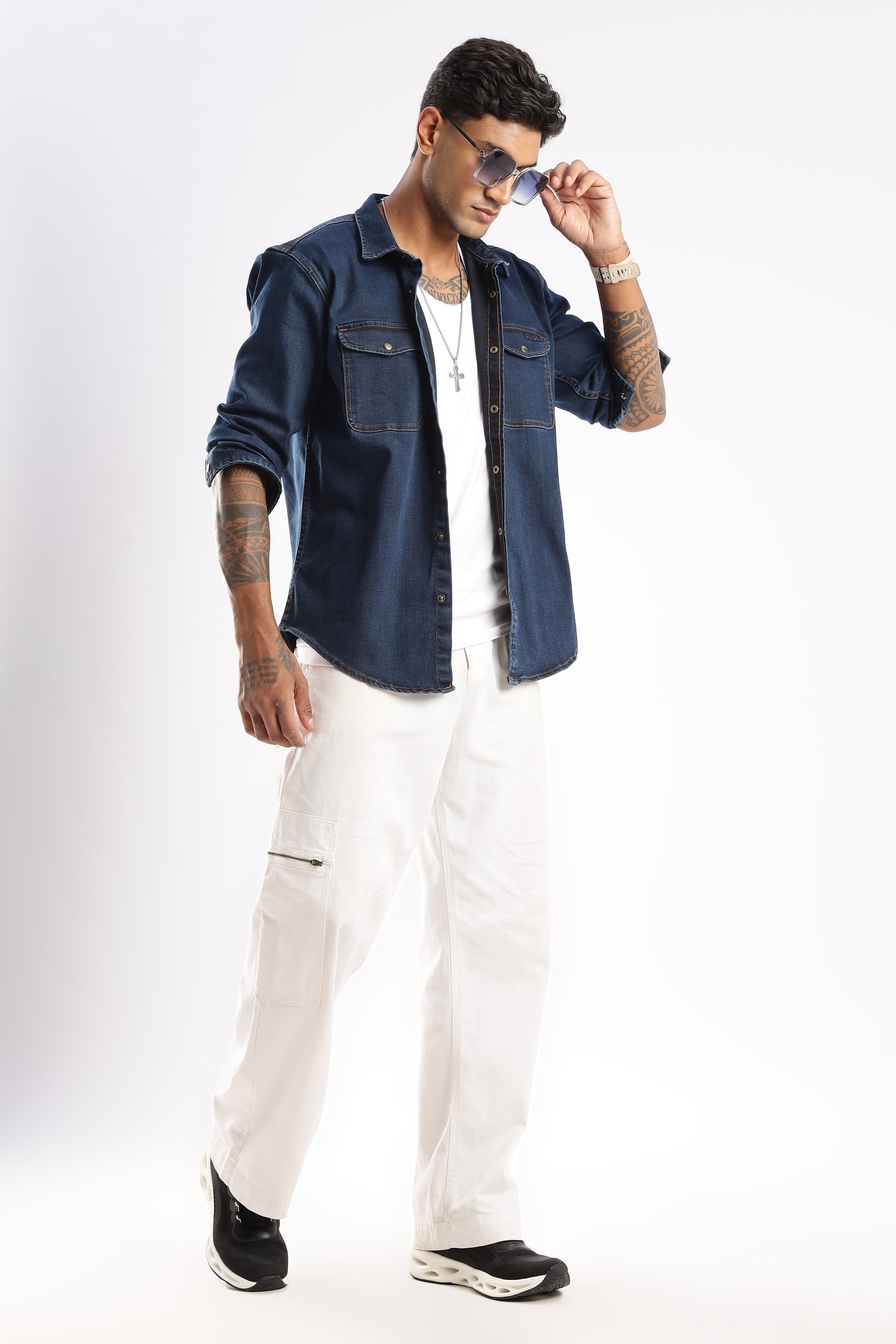 Flat lay of Premium Denim Shirt in Midnight Forge highlighting collar, buttons, and fabric