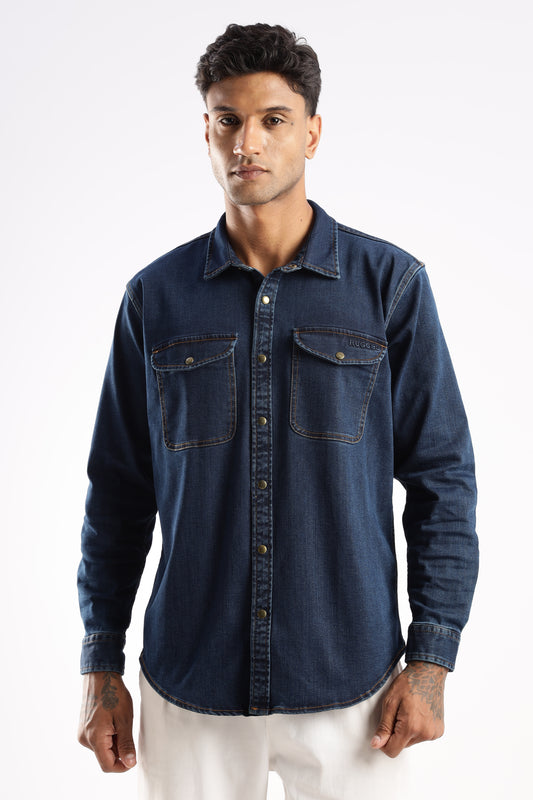 Model wearing Premium Denim Shirt in Midnight Forge with snap buttons and utility pockets