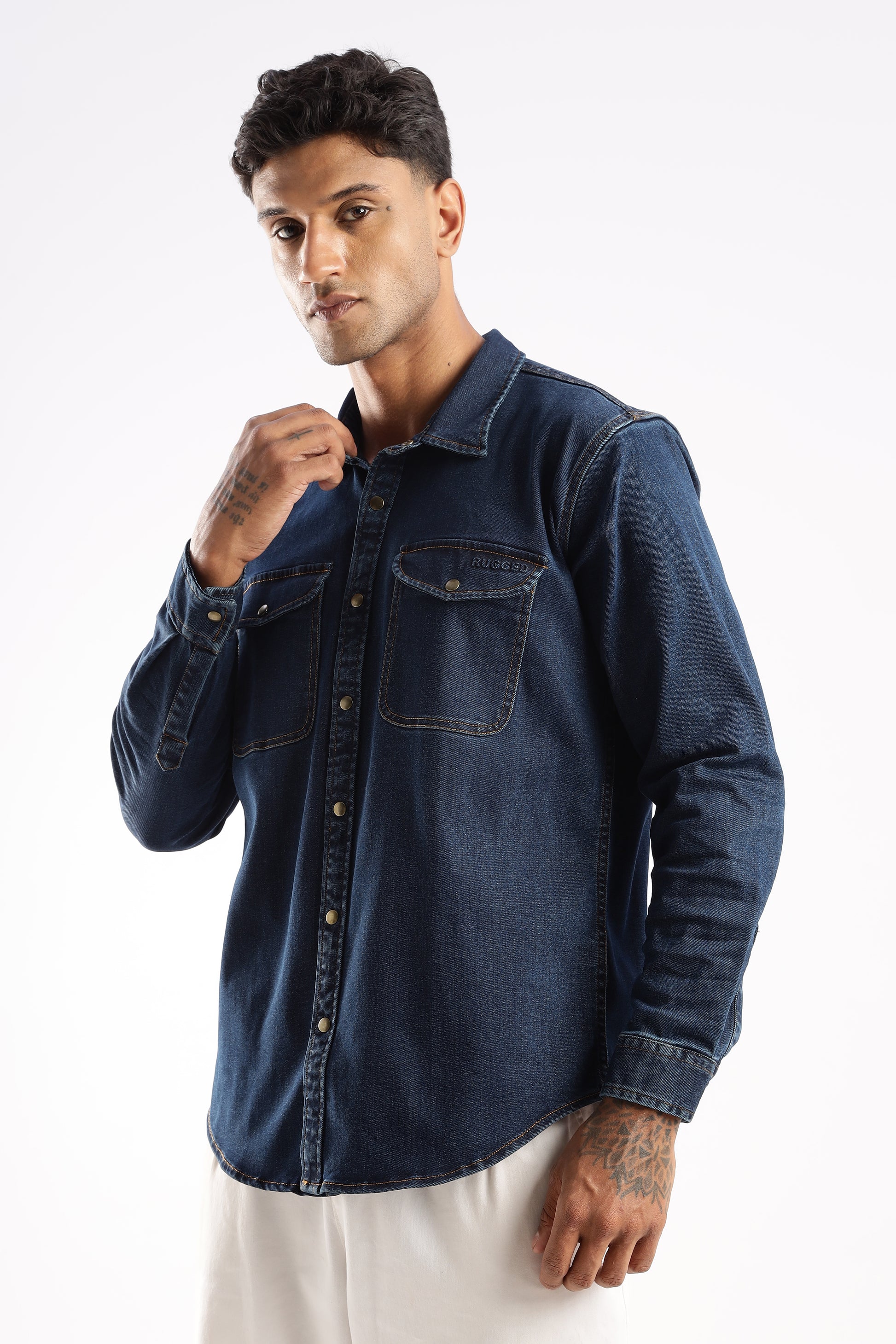Model layering Midnight Forge denim shirt over a t-shirt for versatile styling