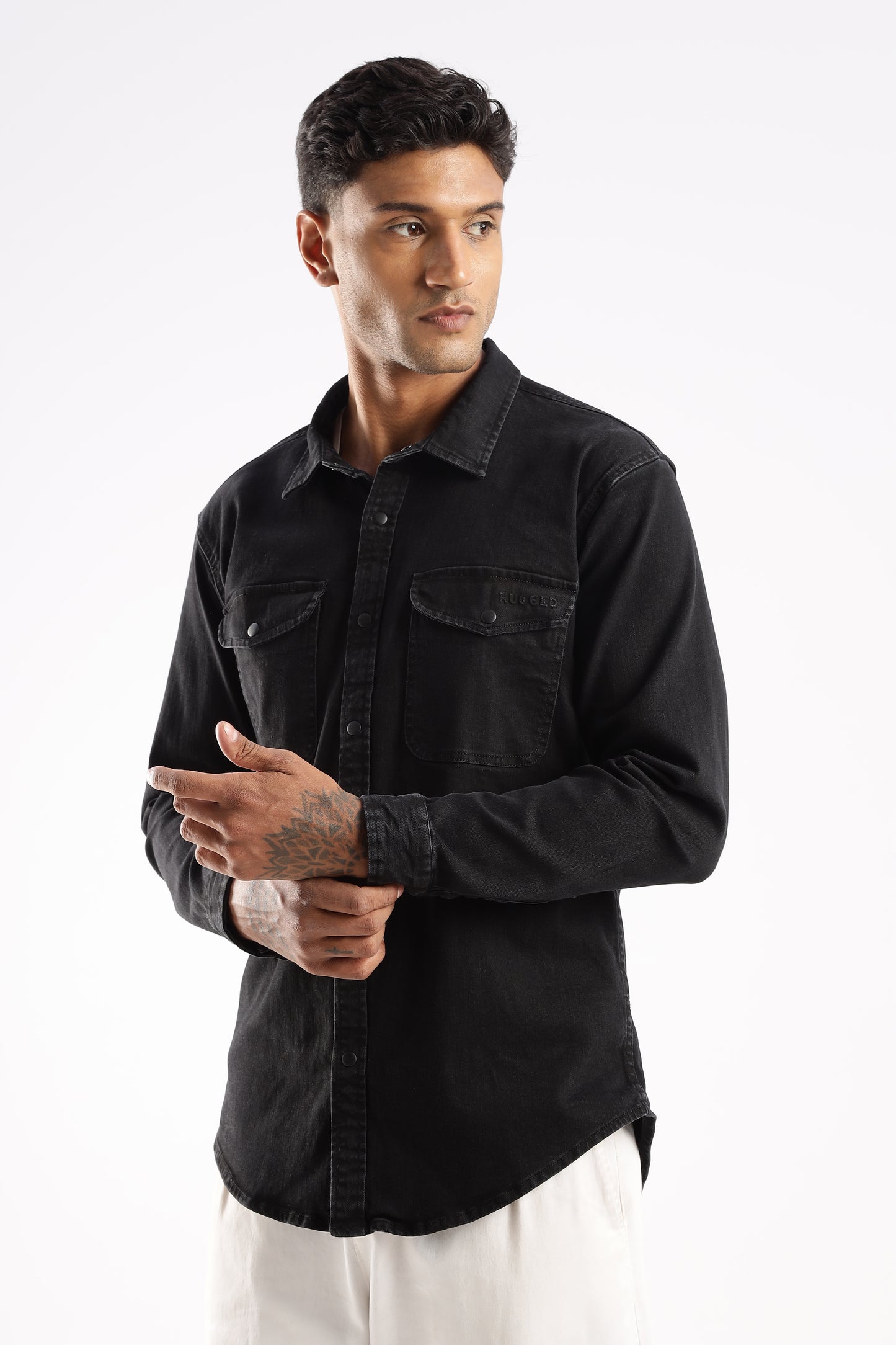 Close-up of Obsidian Edge denim fabric showing texture, seams, and matte finish

