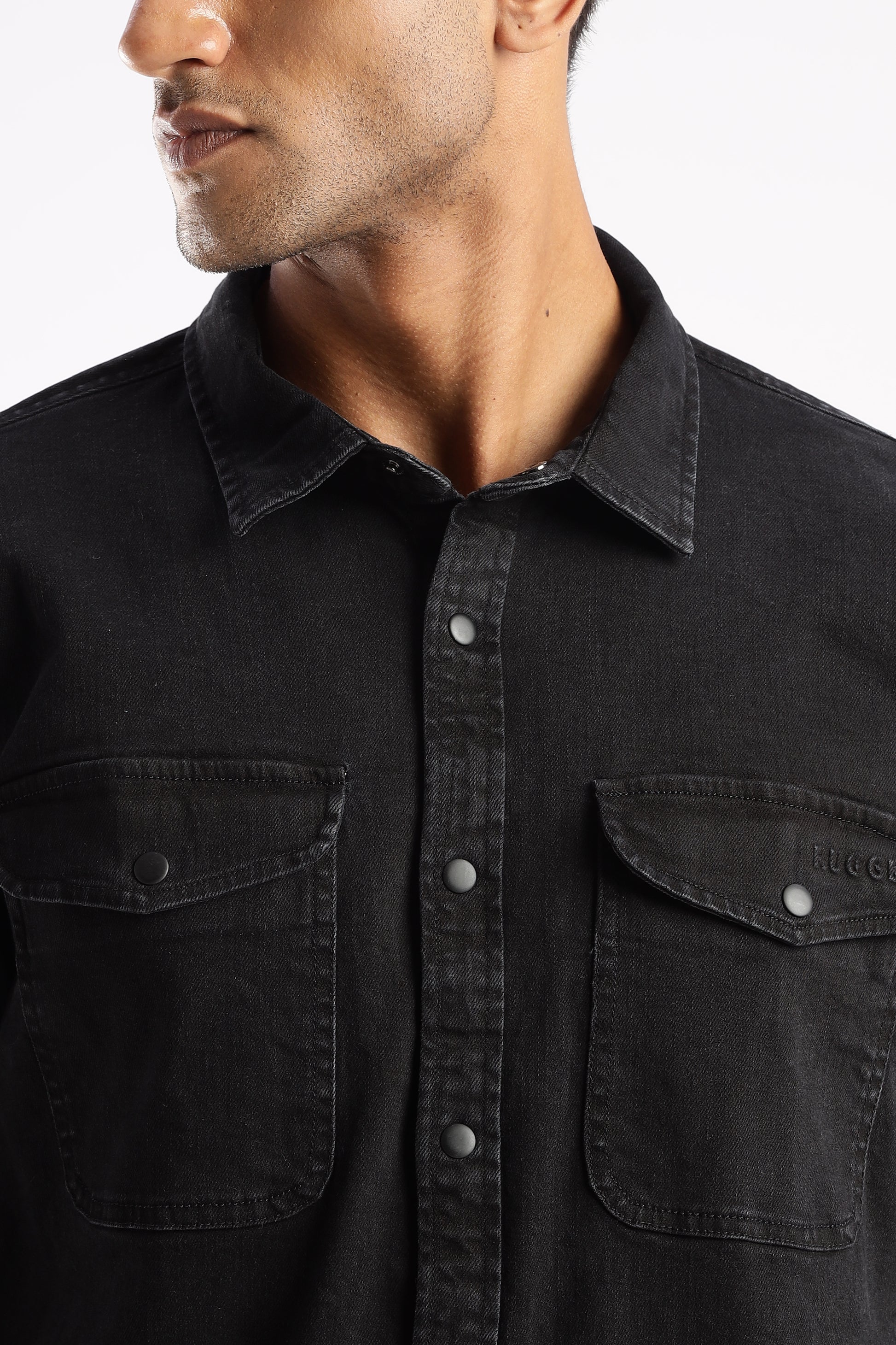 Back view of Obsidian Edge denim shirt showing structured shoulders and yoke detail