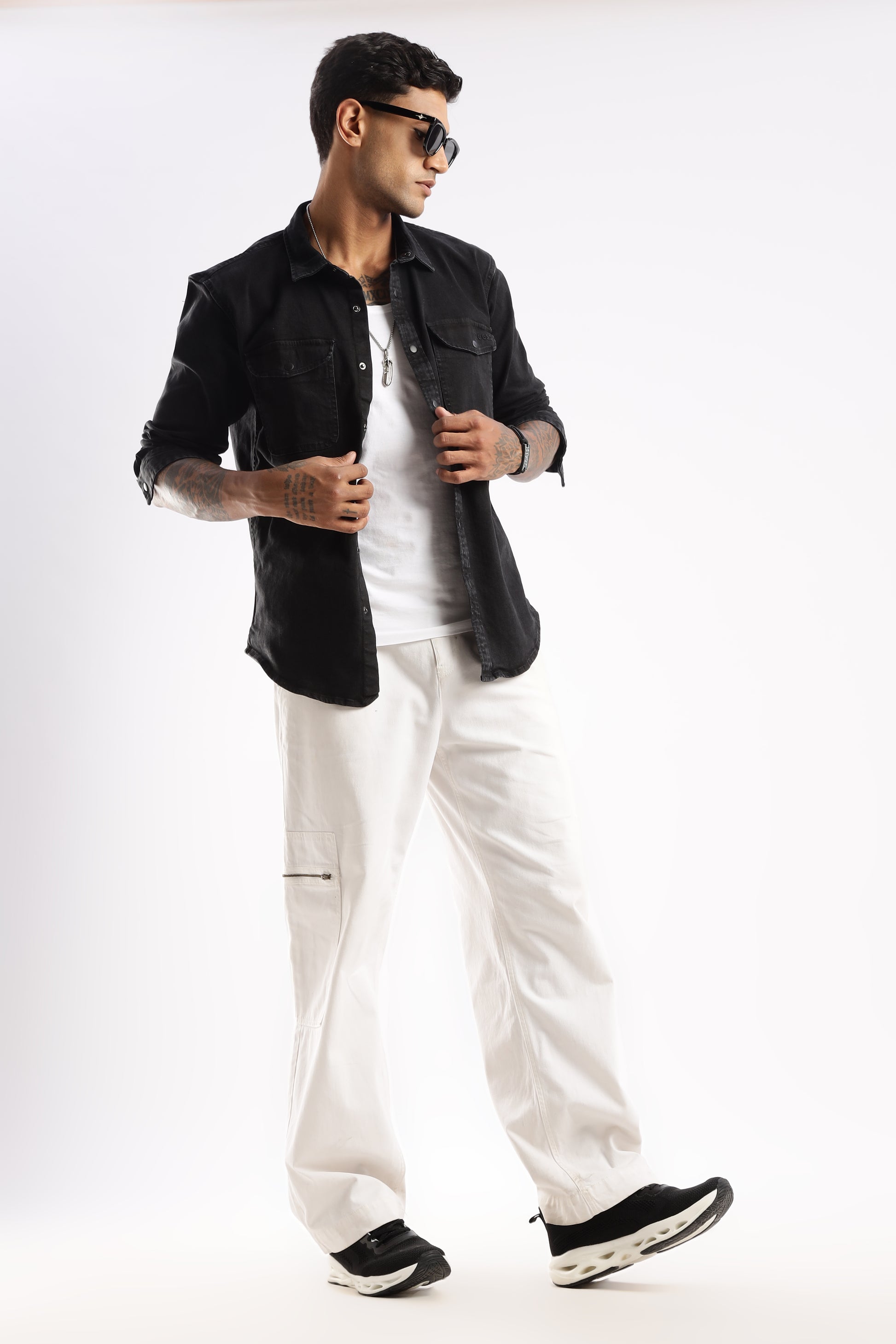 Model layering Obsidian Edge denim shirt over a crew neck tee for casual styling