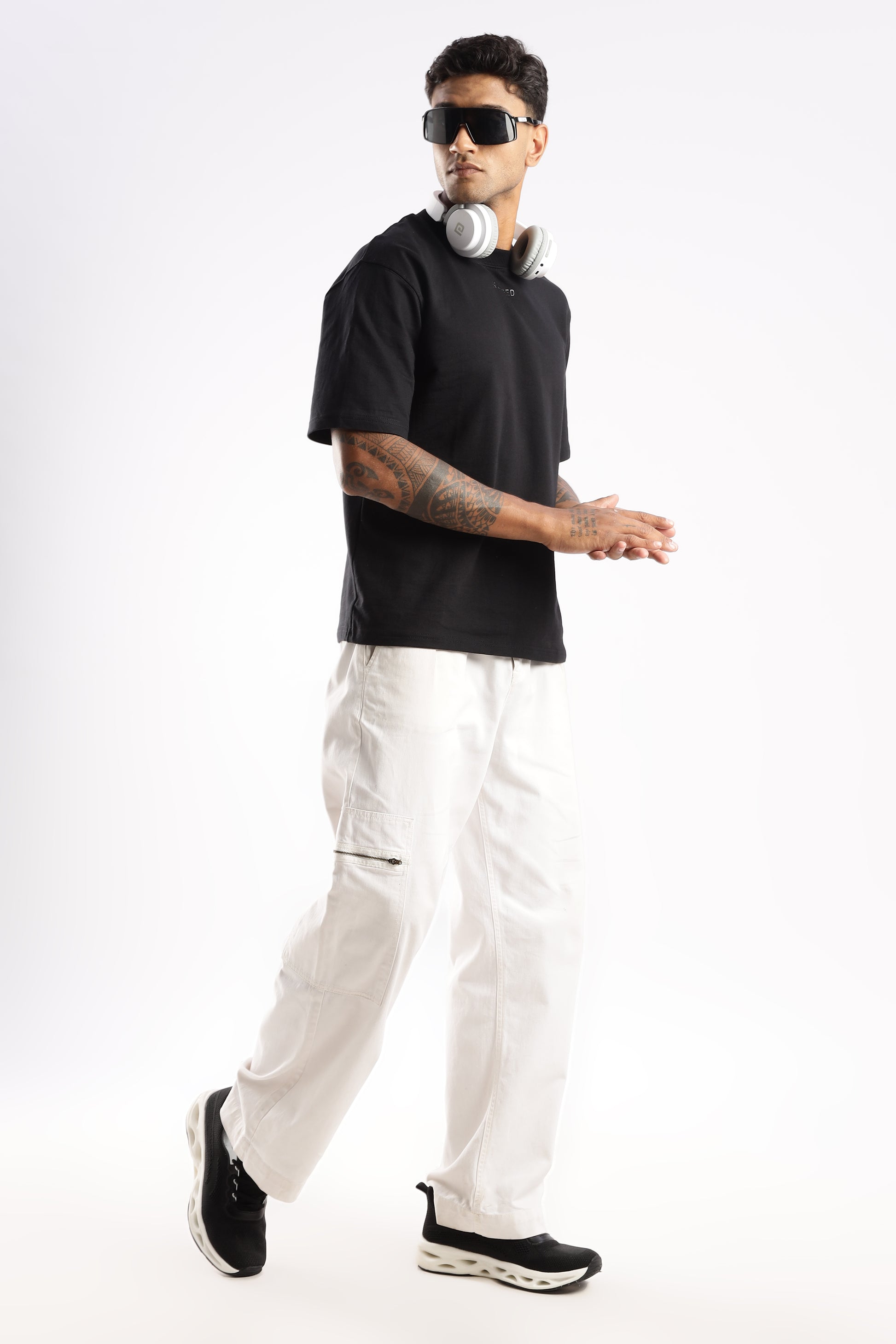 Model styled in Onyx Depth t-shirt layered under a denim jacket for urban versatility