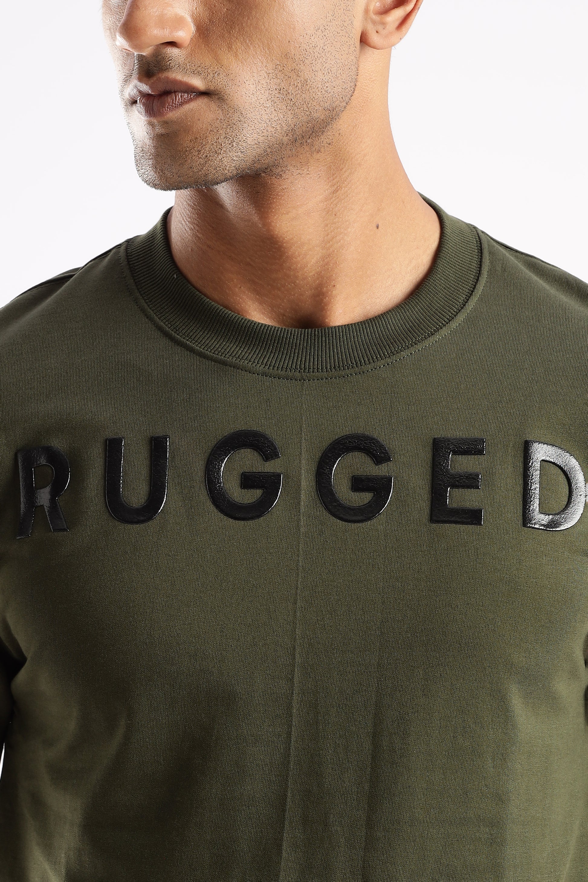 RUGGED Signature Tee in Evergreen Mist styled with jeans for everyday wear

