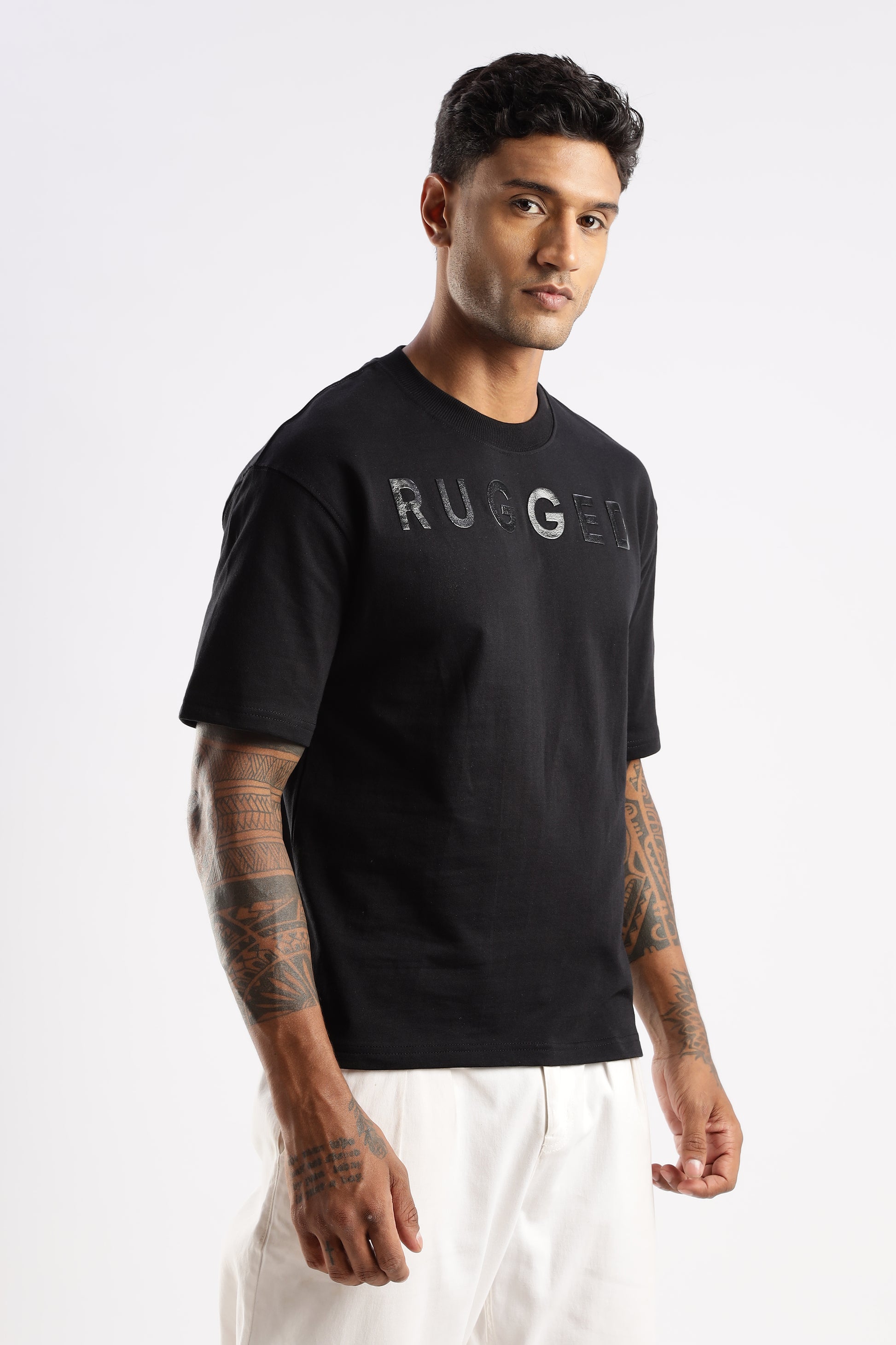 Lifestyle image of man wearing Onyx Depth Signature Tee in an outdoor setting