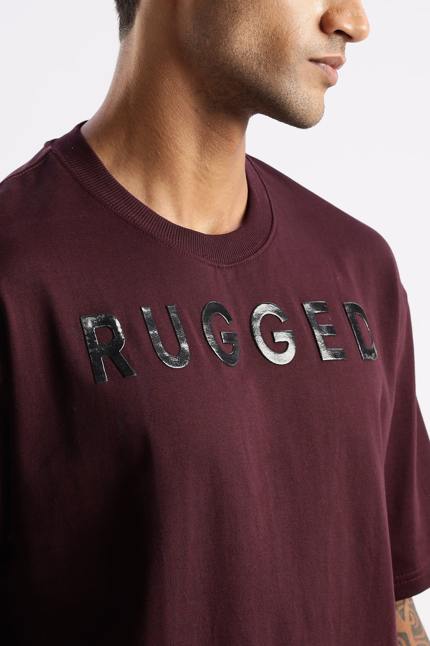 Men’s red crew neck t-shirt in Crimson Peak, styled with dark denim jeans