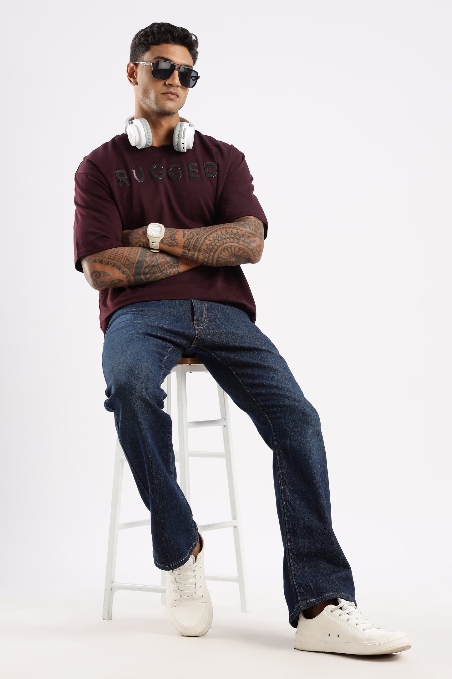 Lifestyle shot of man wearing Crimson Peak crew neck tee while walking outdoors

