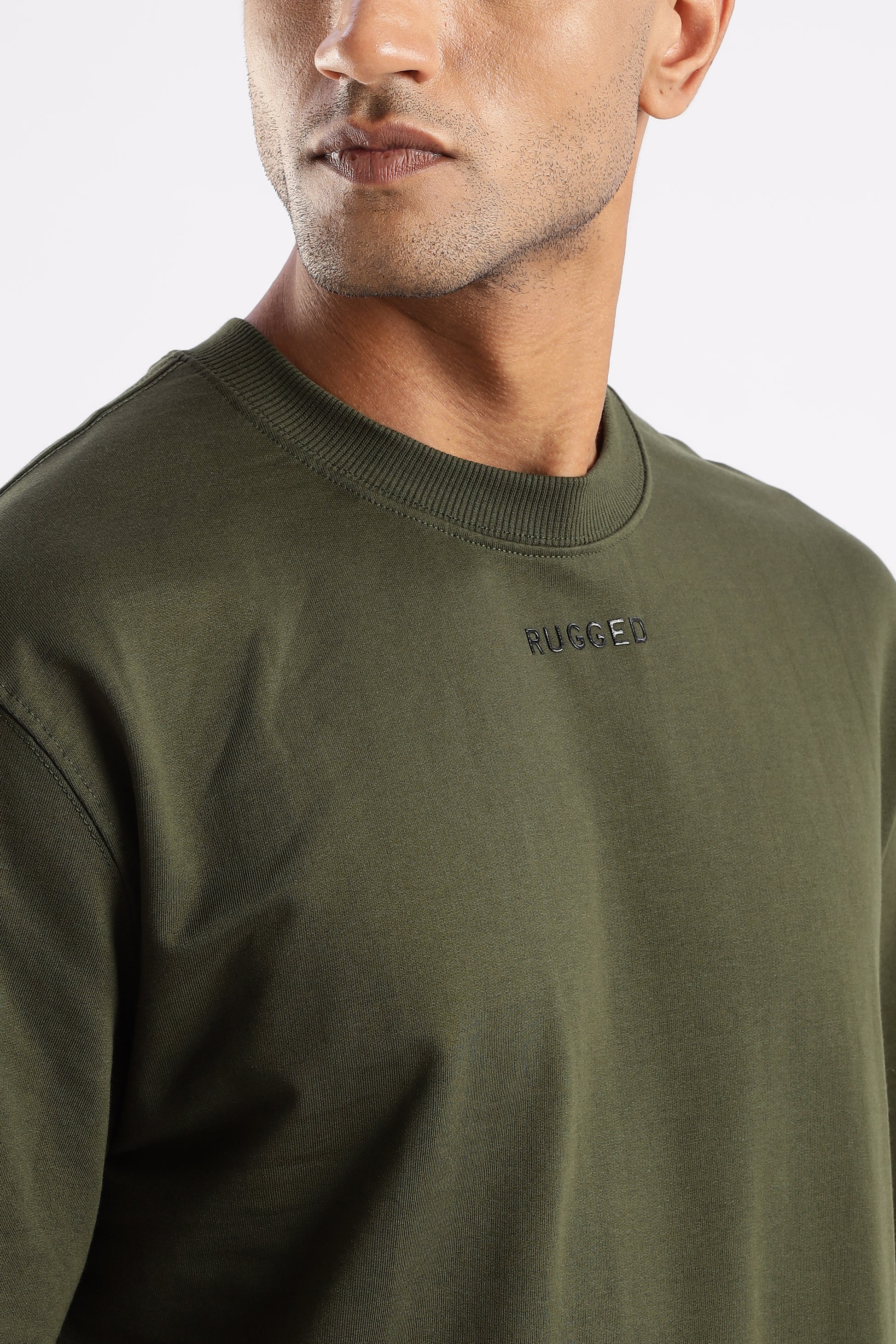 Back view of Elegant Crew Tee in Evergreen Mist showing smooth drape and modern cut