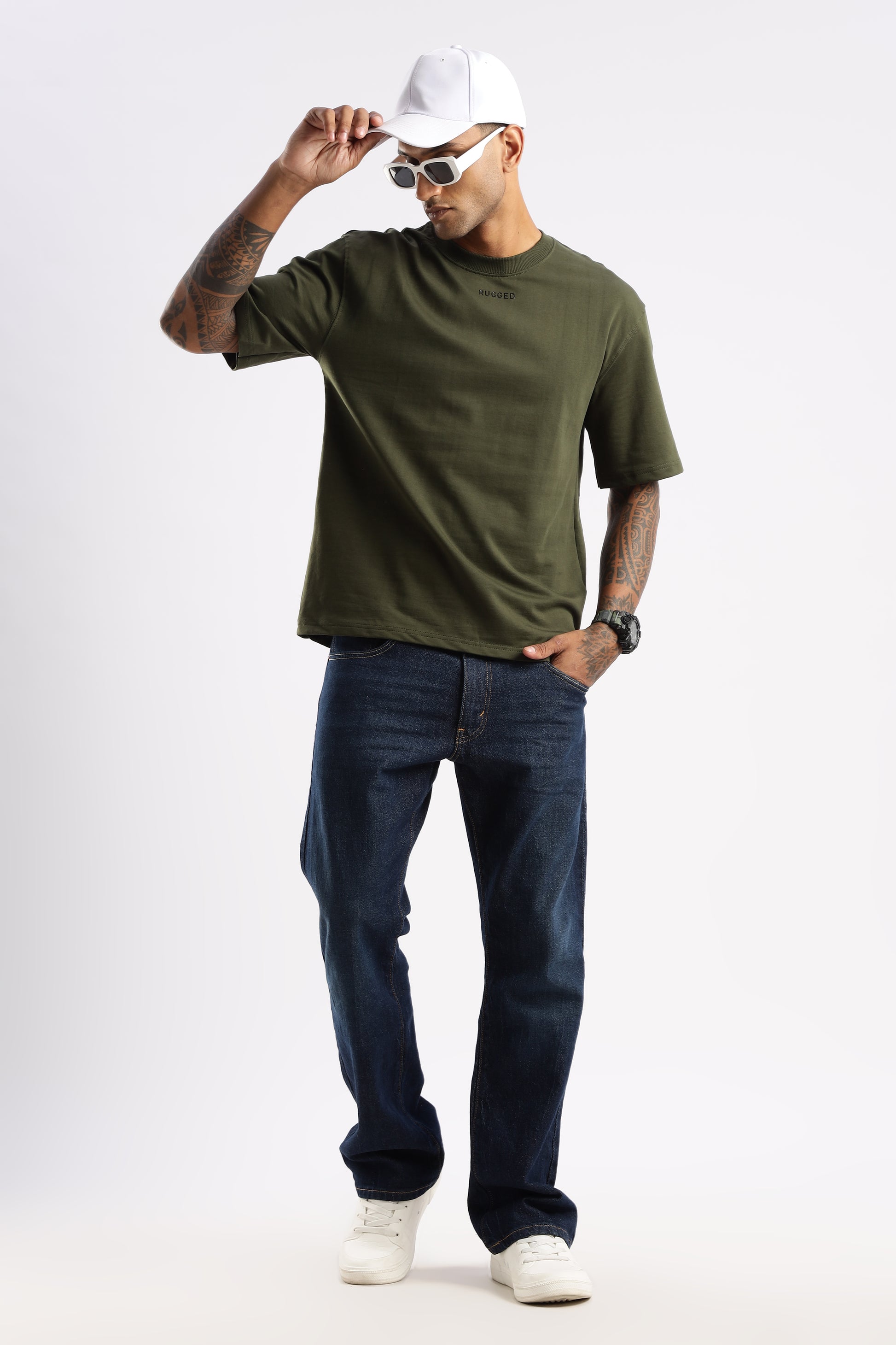 Model showcasing Evergreen Mist crew tee styled under a flannel shirt for layering