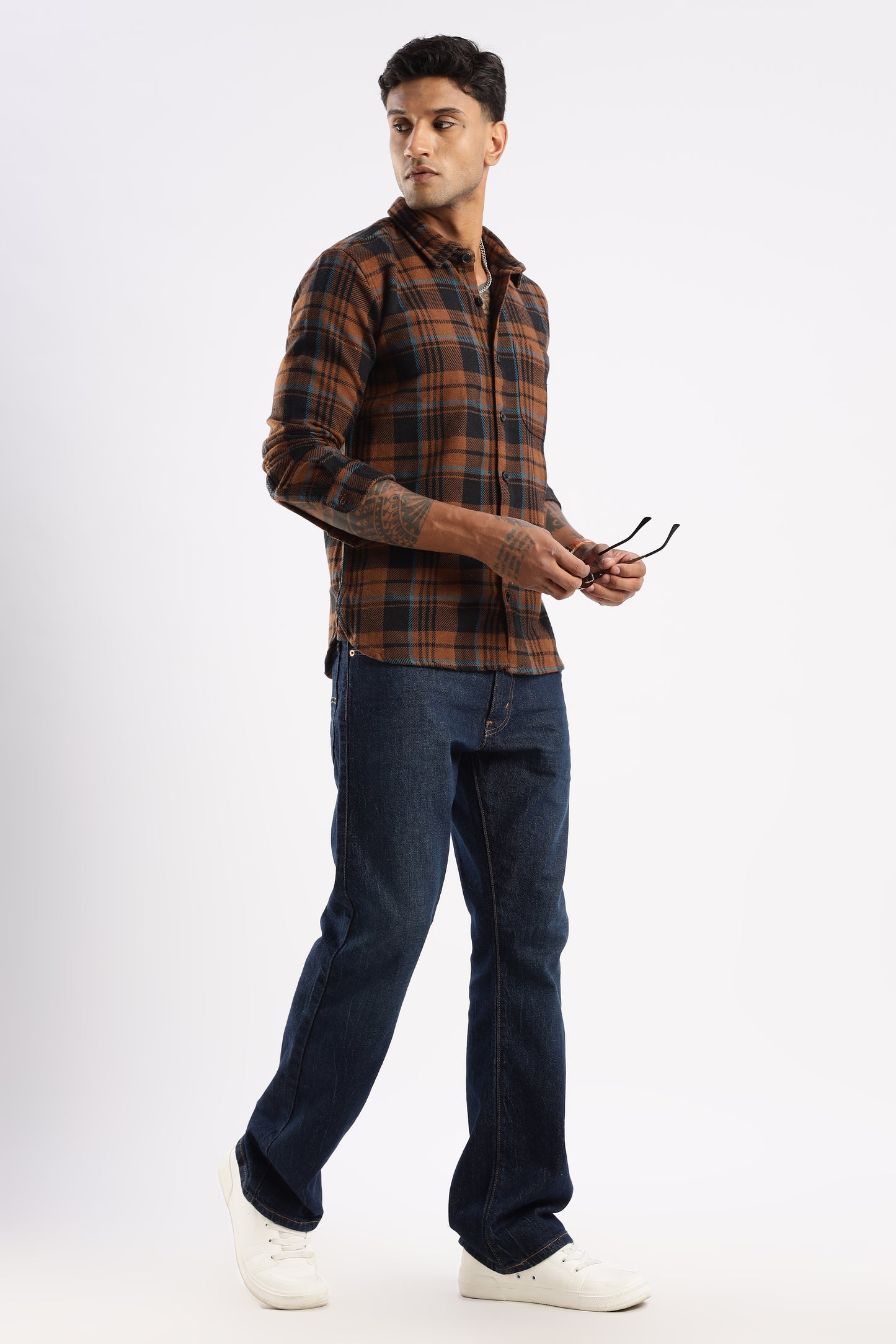 Casual outfit featuring Timberland Rust flannel shirt paired with denim jeans
