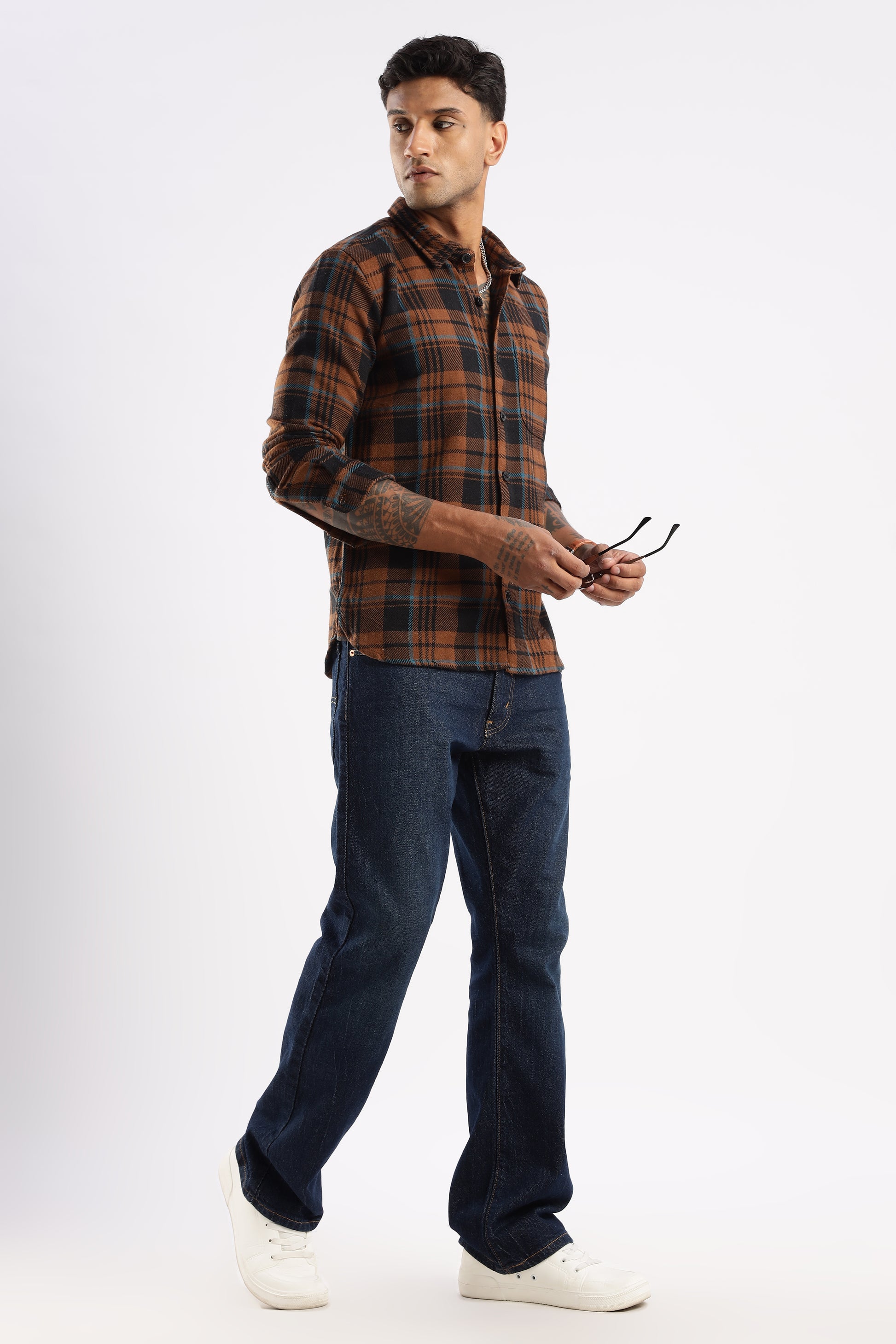 Casual outfit featuring Timberland Rust flannel shirt paired with denim jeans