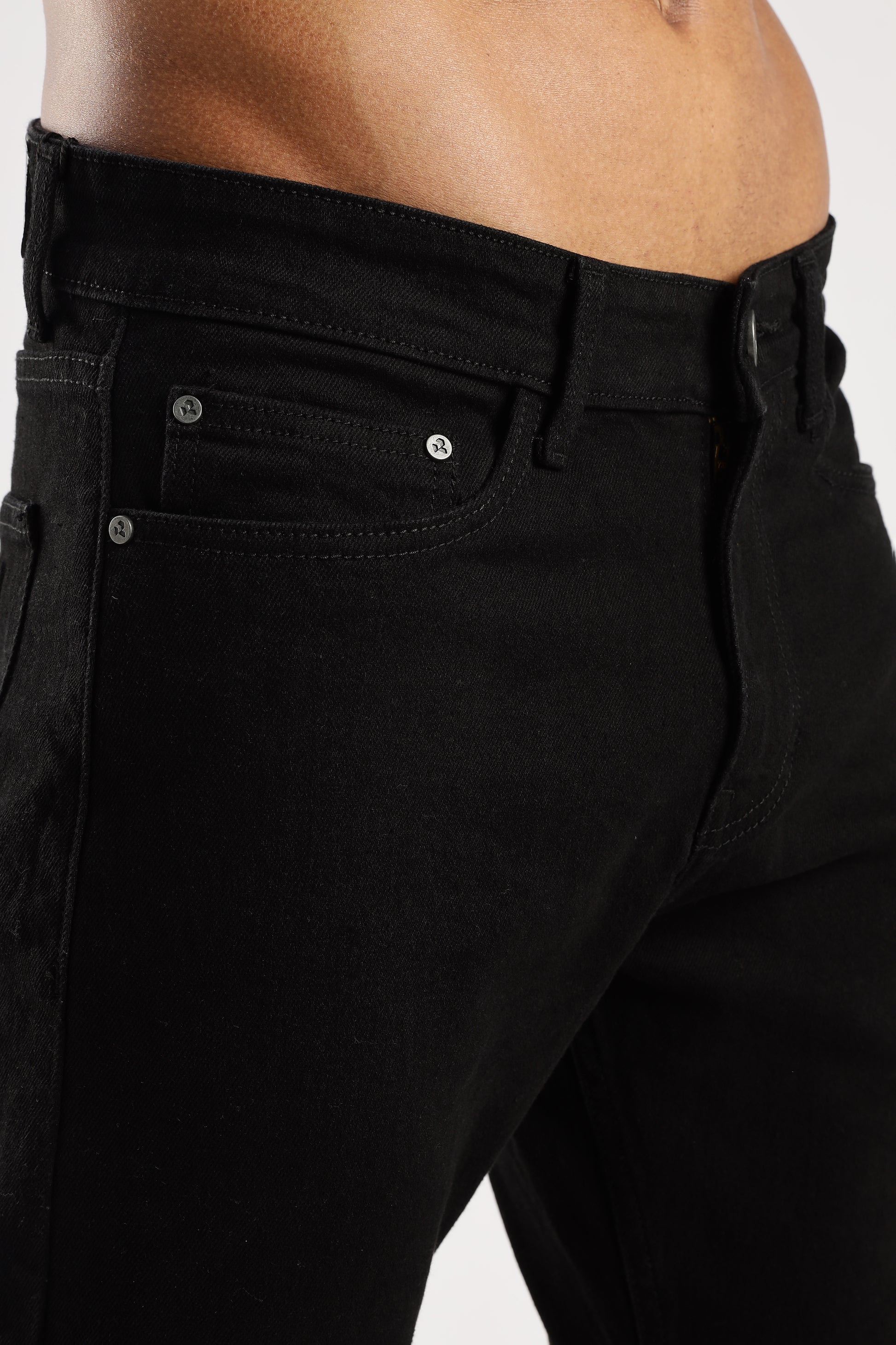 Side view of Shadow Trail jeans highlighting the tapered leg and structured fit