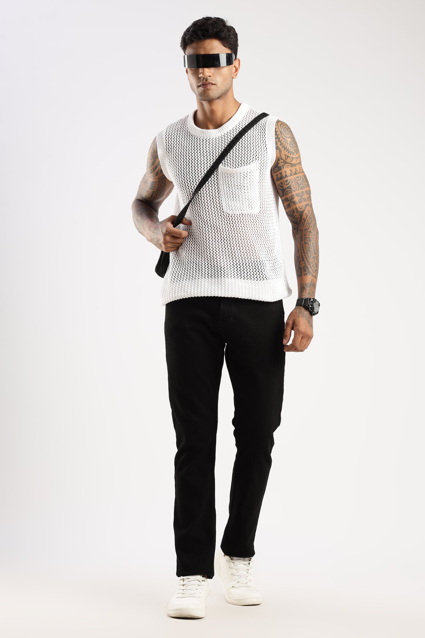 Lifestyle shot of model walking in Shadow Trail tapered fit jeans with boots