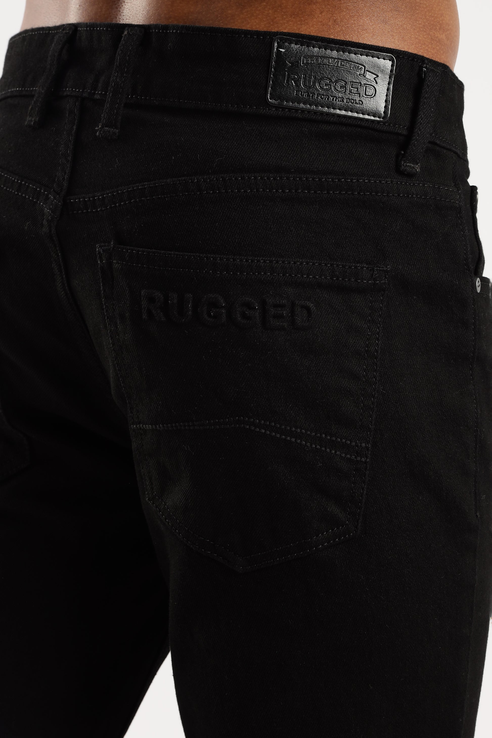 Flat lay of Shadow Trail bootcut jeans with classic 5-pocket design and button fly