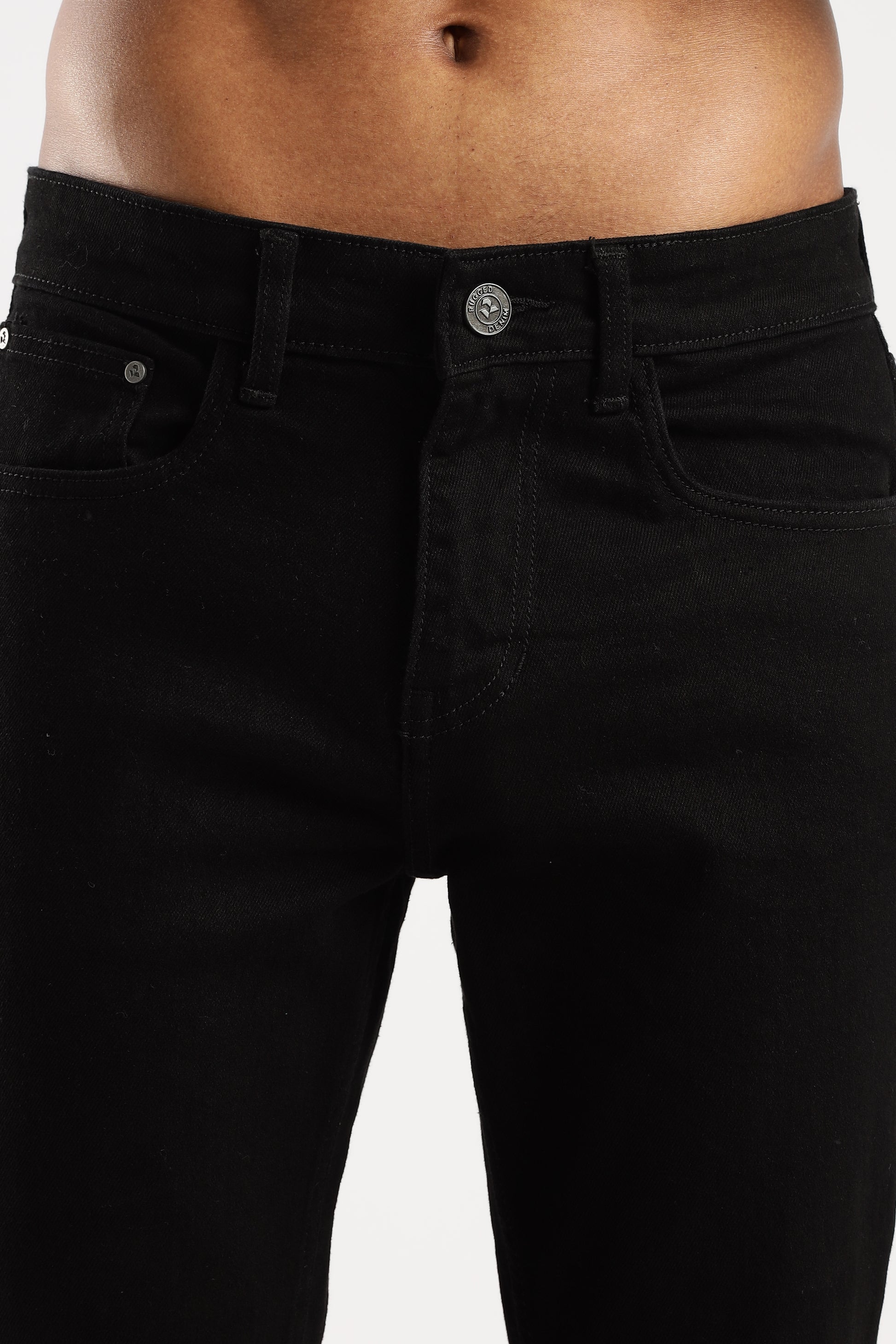 Lifestyle shot of model wearing Shadow Trail bootcut jeans paired with boots

