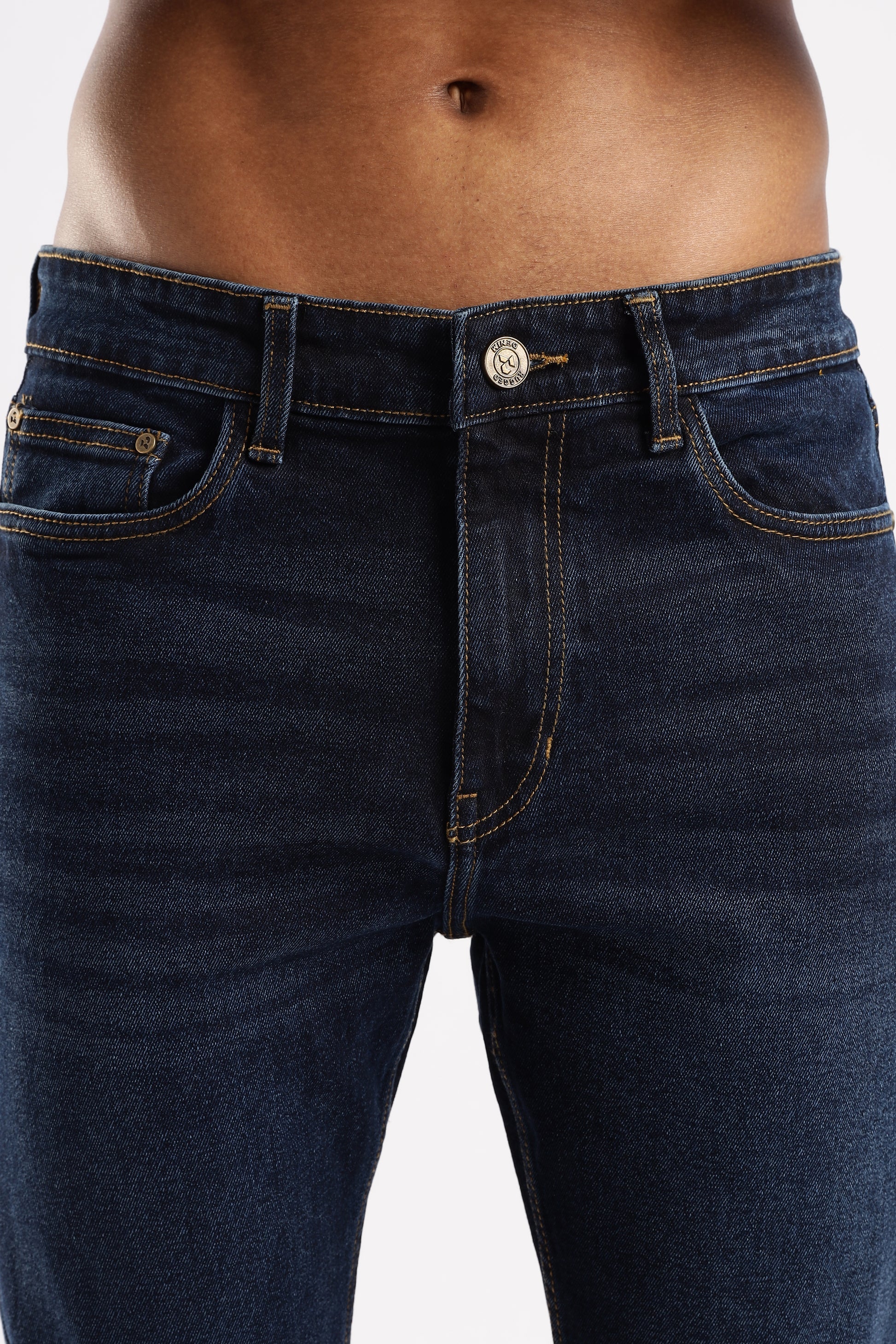 Close-up of Steel Wave denim showing twill weave texture and precision stitching